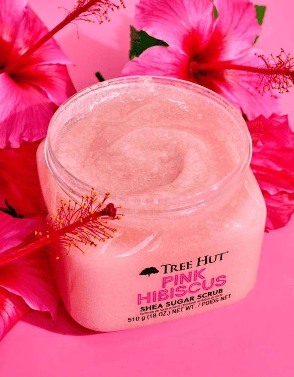 An open tub of tree hut pink hibiscus shea sugar scrub.